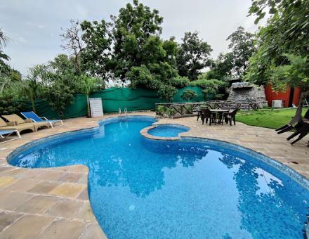 Dive into Luxury: The Stunning Swimming Pool at The Nature Nest Hotel & Resorts
